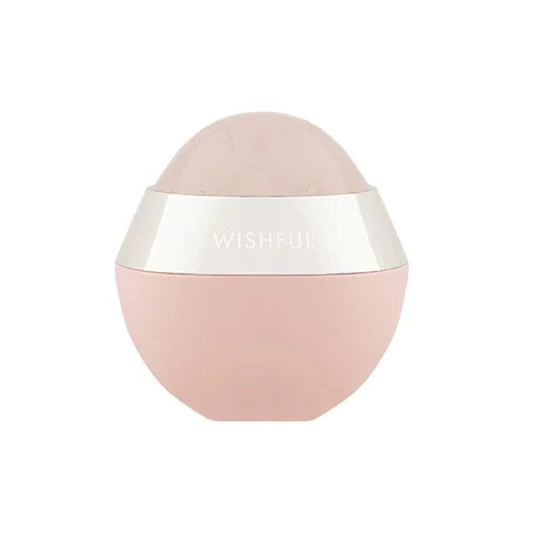 Pink rose quartz sculpting roller with silver band labeled Wishful on white background