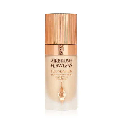 Glass bottle of Airbrush Flawless Foundation with gold cap, makeup product for smooth coverage