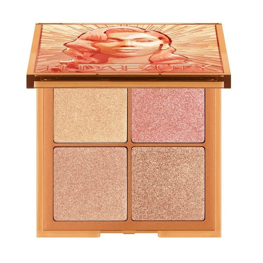 Shimmer makeup palette with four highlighter shades in a gold compact