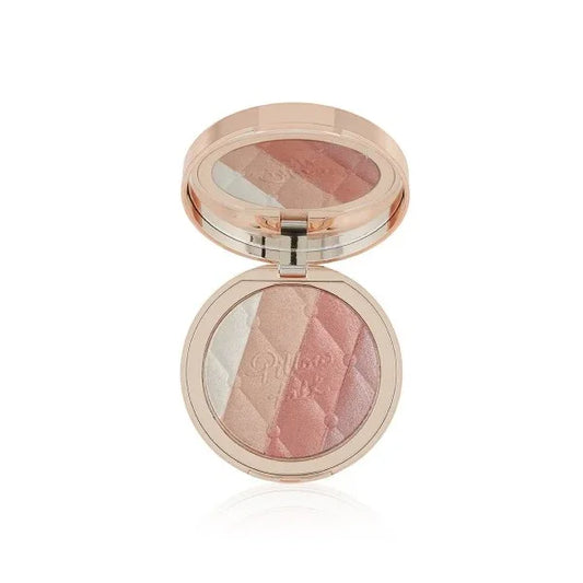 Open compact with multi-shade glow highlighter in pink, peach, and champagne tones