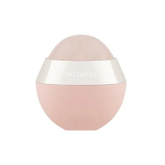 Pink rose quartz sculpting roller with silver band labeled Wishful on white background