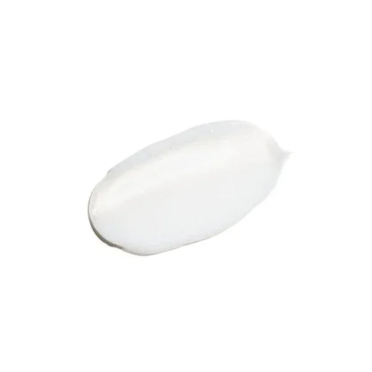 White creamy skincare cleanser swatch on a plain white background