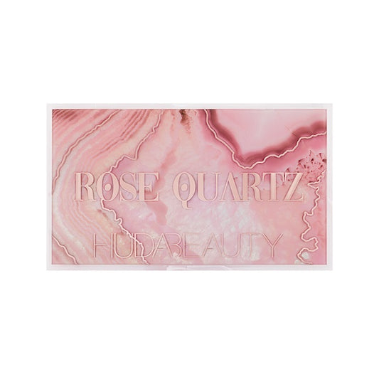 Closed rose quartz eyeshadow palette with pink marble design and bold text on the lid