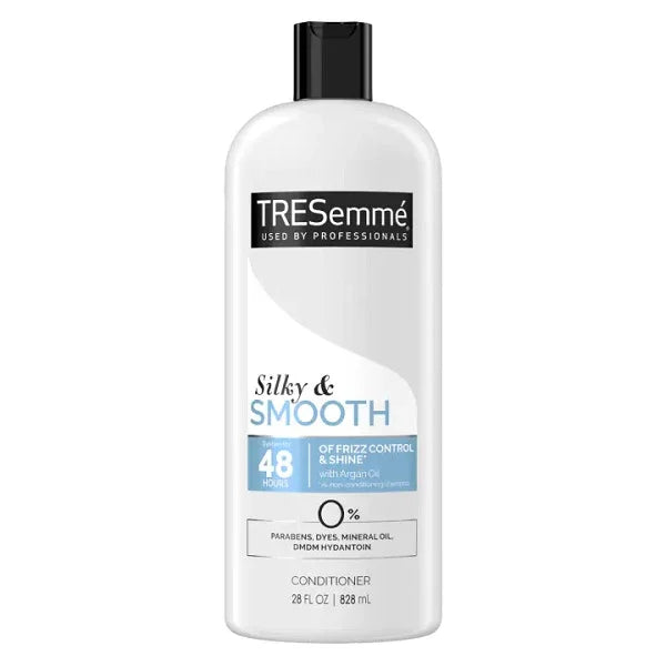 TRESemmé Silky & Smooth conditioner bottle for frizzy hair, 28 fl oz, with argan oil